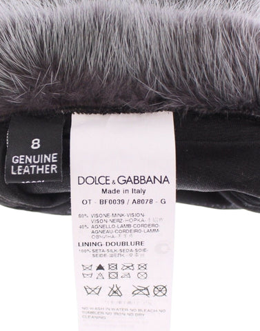 Gray mink fur and lambskin suede leather gloves by Dolce & Gabbana, showing the soft fur-lined exterior and sleek design.