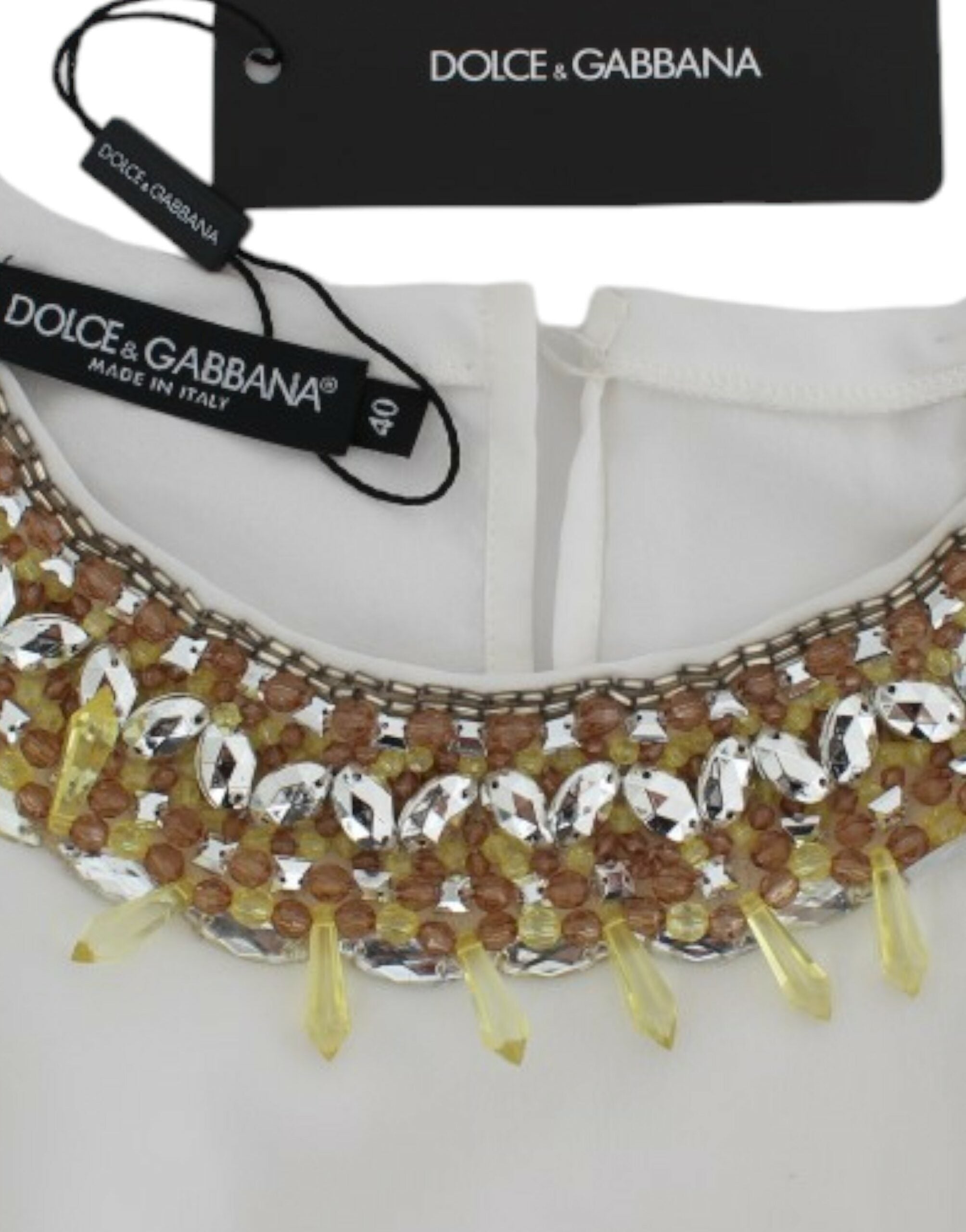 White crystal-embellished tank top by Dolce & Gabbana, featuring sparkling crystals and a sleek sleeveless design.