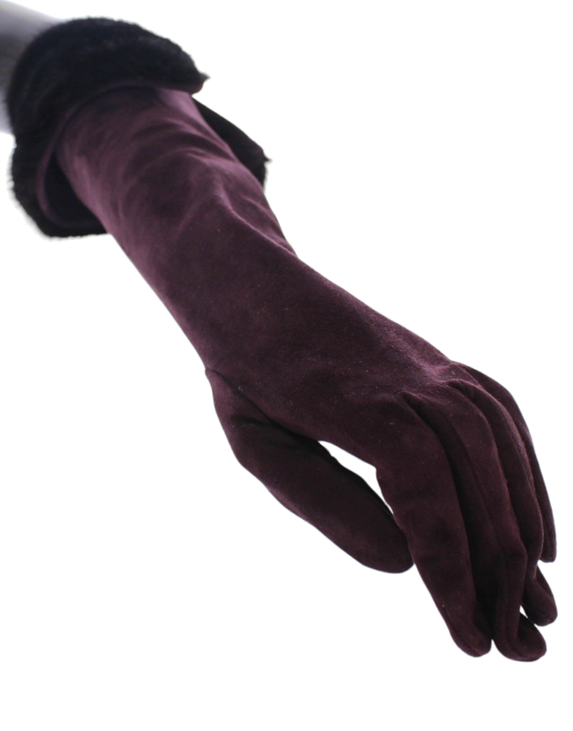 Purple mink fur and goatskin suede leather gloves by Dolce & Gabbana, showcasing soft texture and elegant design.