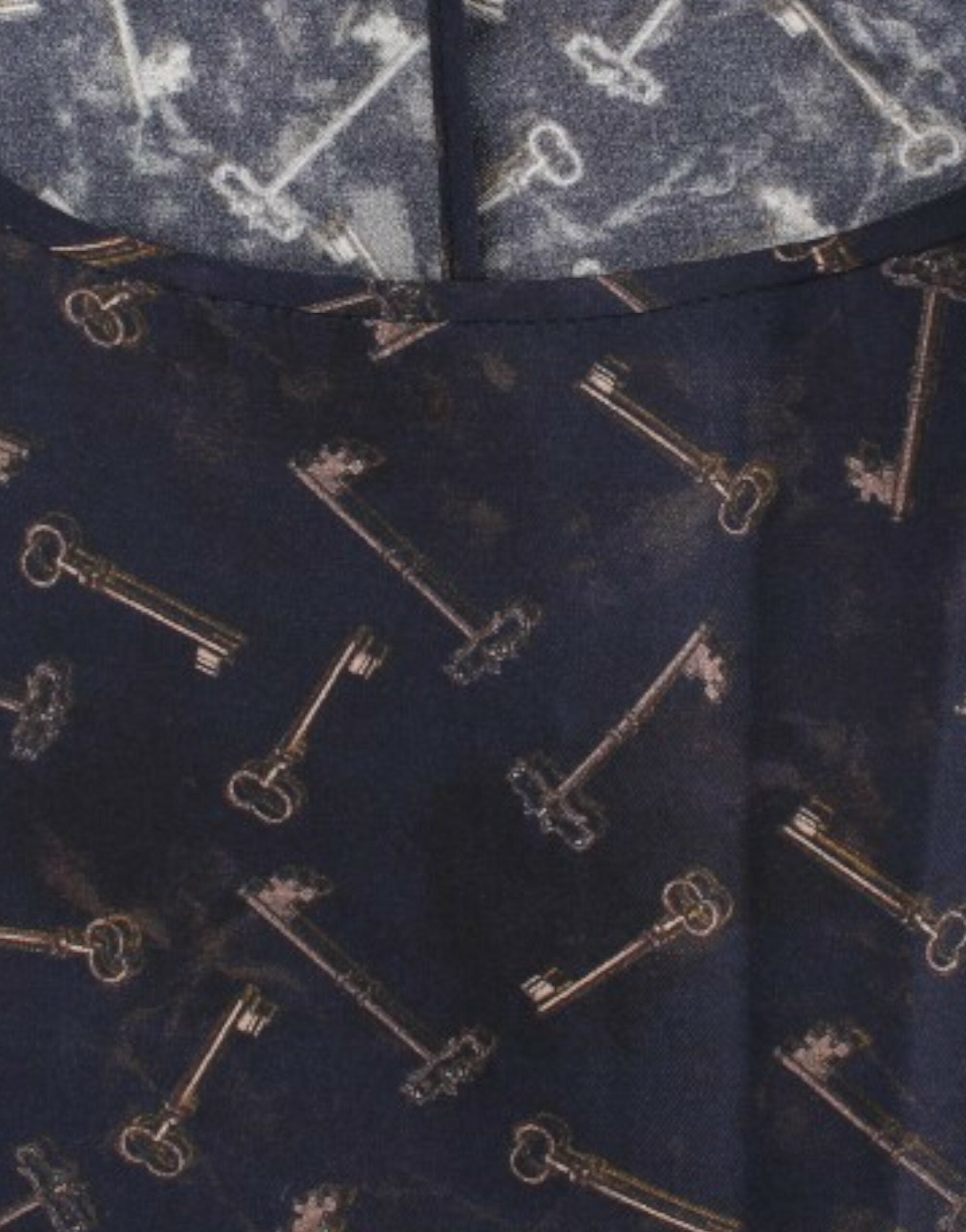 Blue silk blouse with gold key print by Dolce & Gabbana, featuring a stylish, flowing design and elegant neckline.
