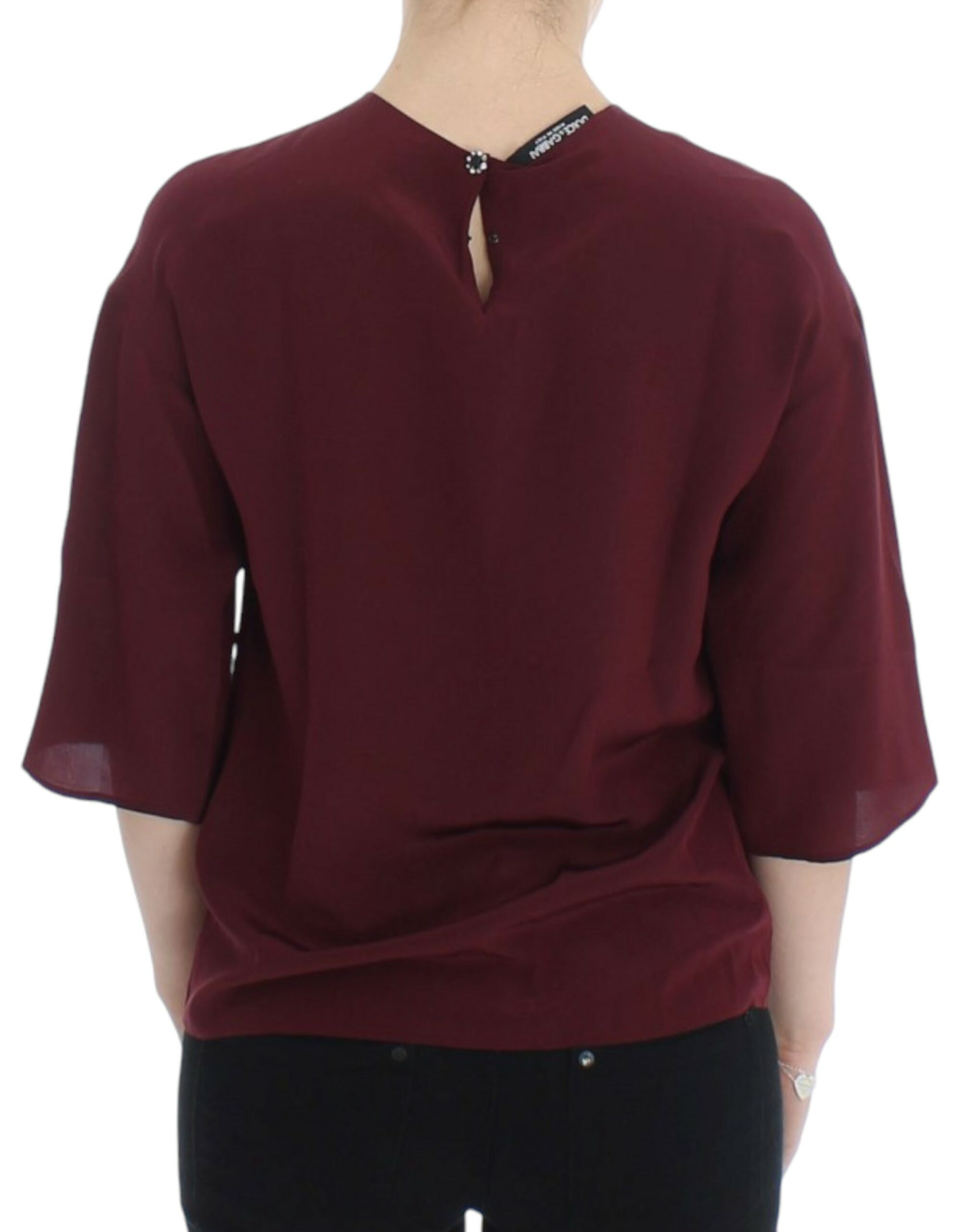 Red 3/4 sleeve silk blouse by Dolce & Gabbana displayed on a hanger with detailed fabric texture.