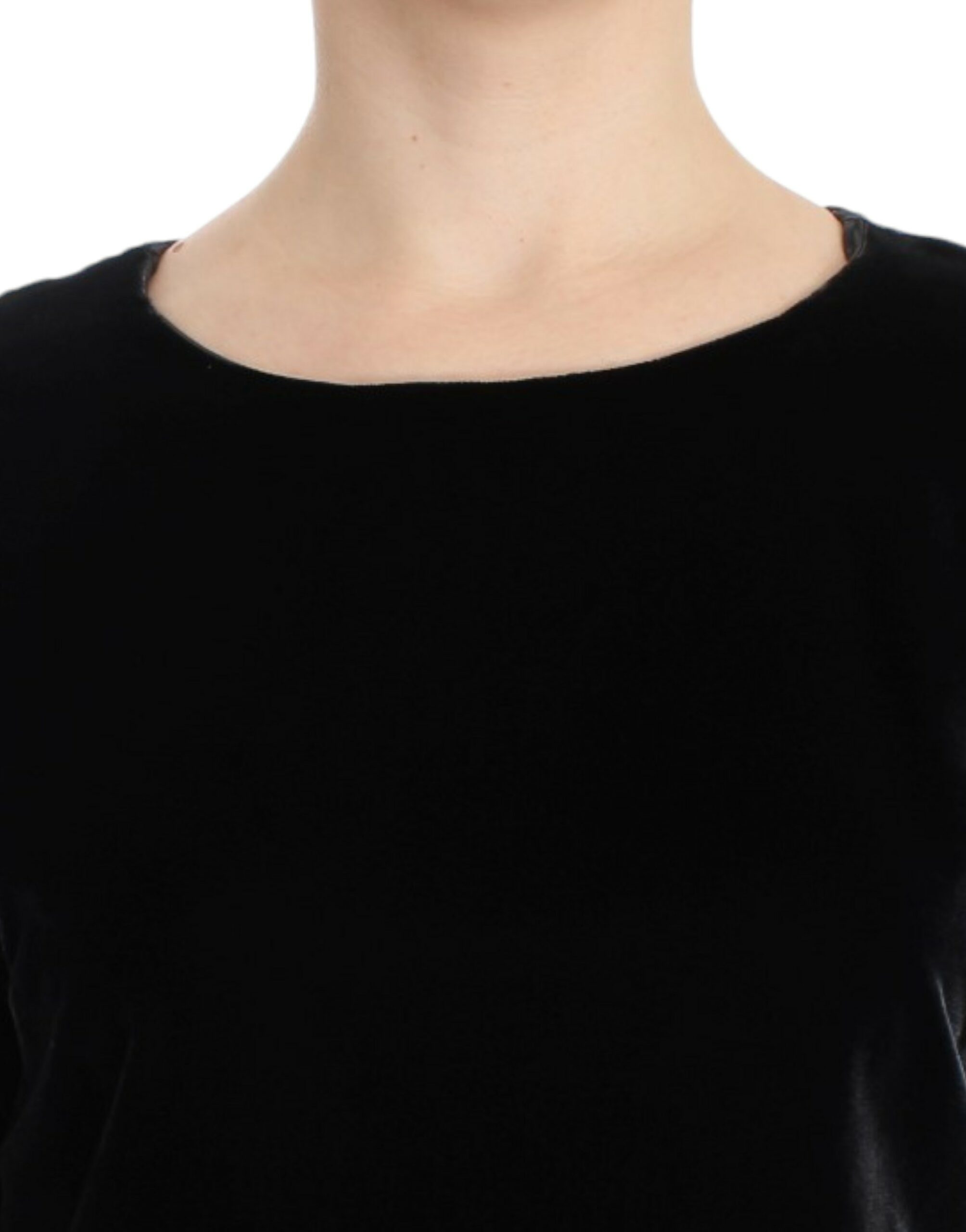 Black velvet shortsleeved blouse by Dolce & Gabbana, showing close-up of luxurious fabric and elegant design details.