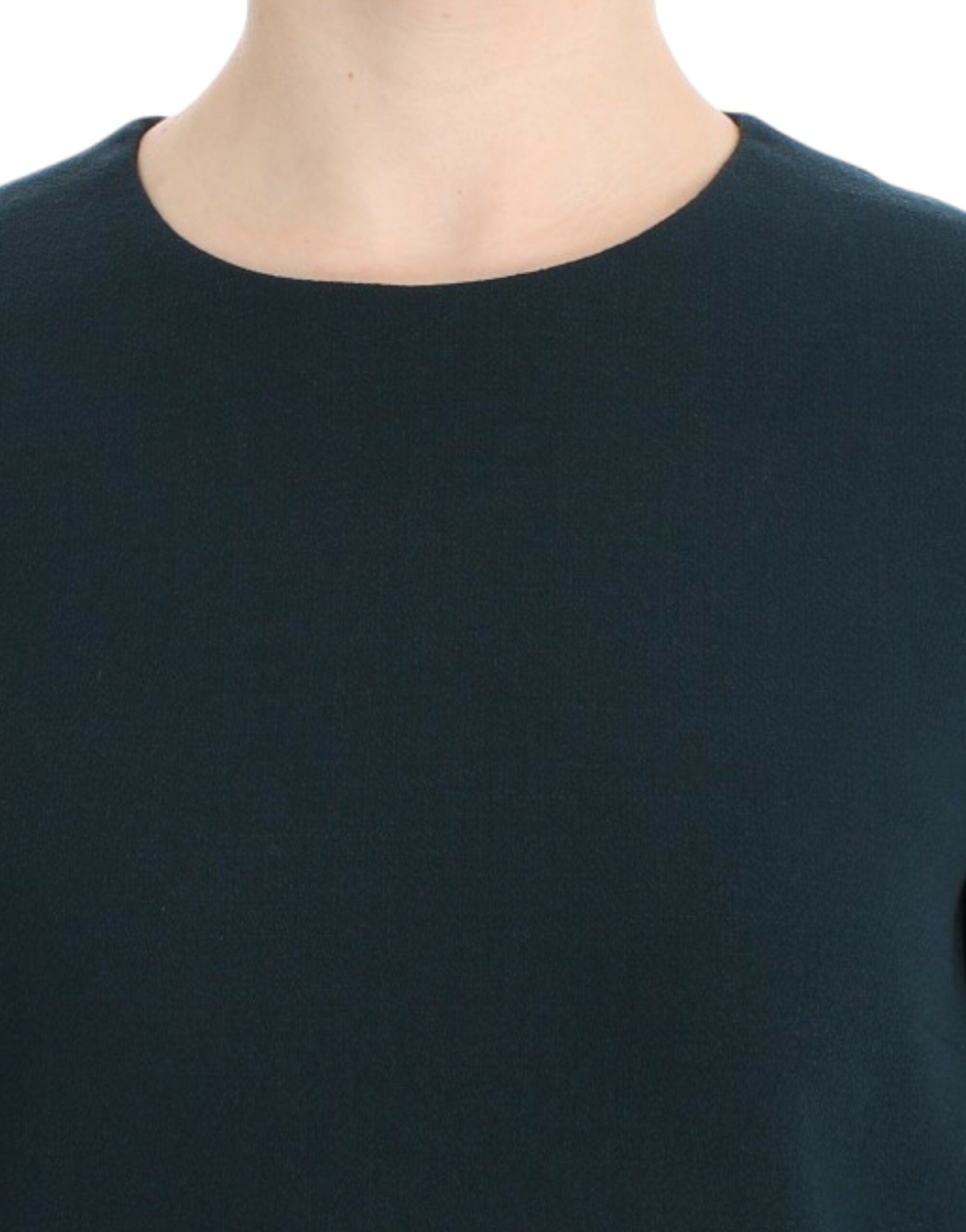 Green 3/4 sleeve wool blouse by Dolce & Gabbana, featuring a stylish fit and textured fabric, shown on a hanger.