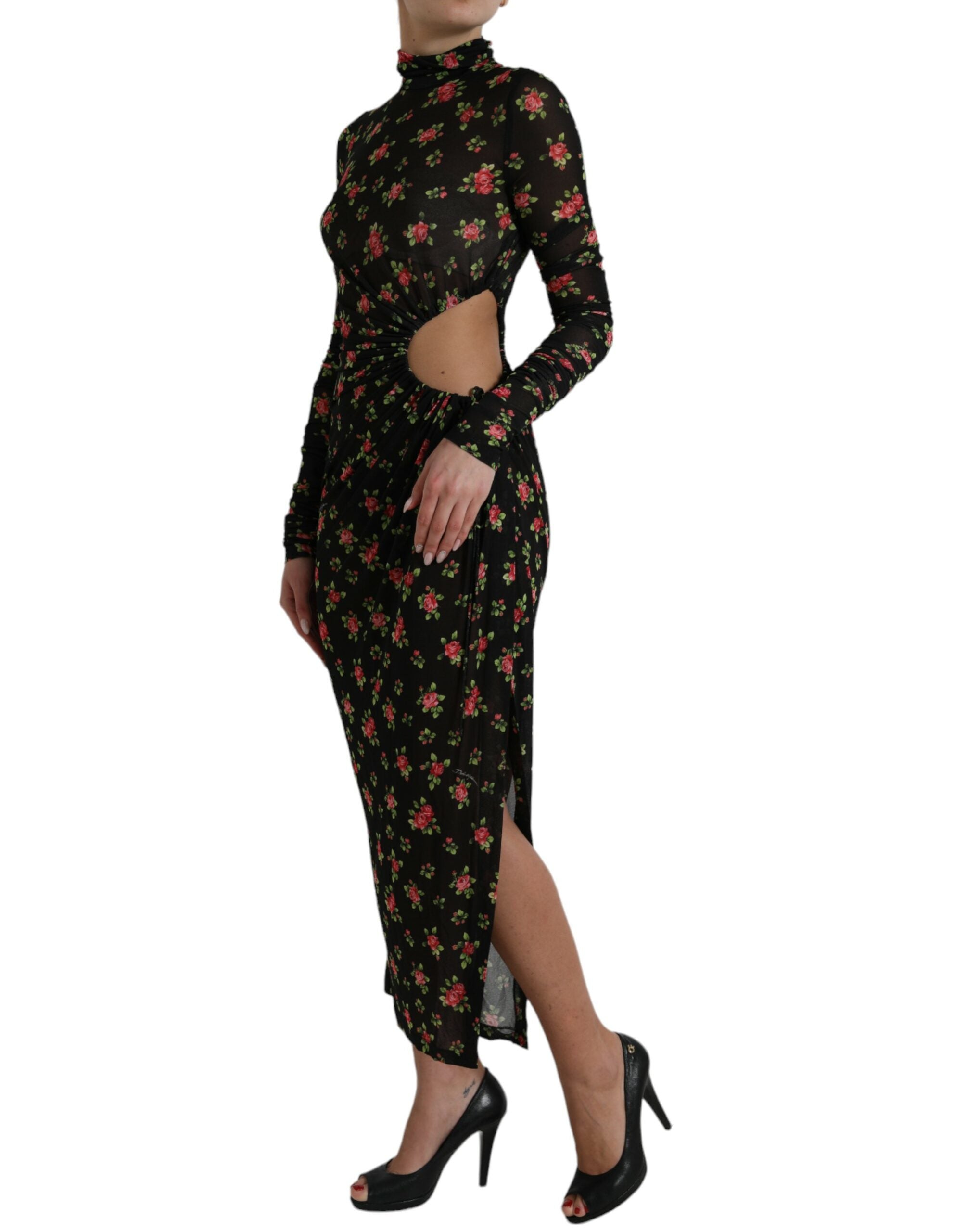 Black floral cut-out sheath maxi dress by Dolce & Gabbana, featuring a fitted silhouette with intricate floral and cut-out details.