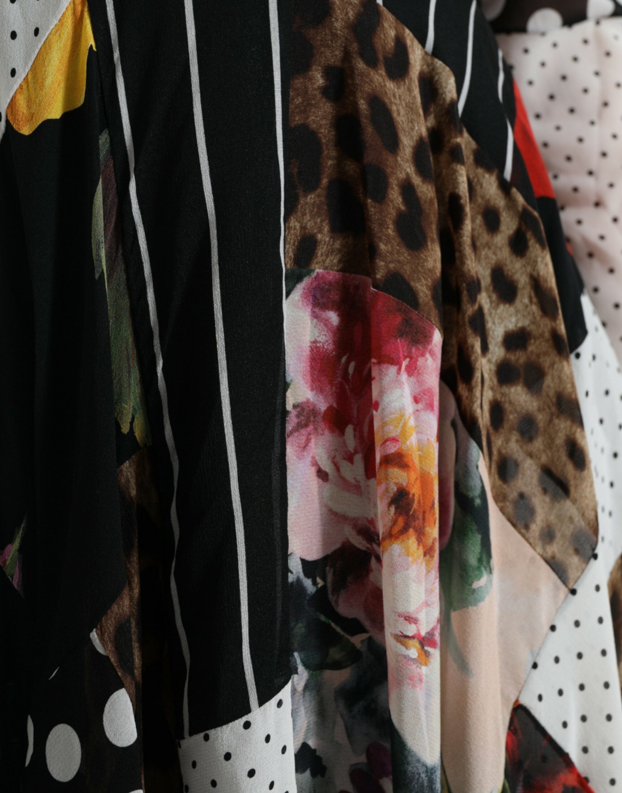 Multicolor patchwork floral leopard dress by Dolce & Gabbana featuring vibrant patterns and a stylish, fitted design.