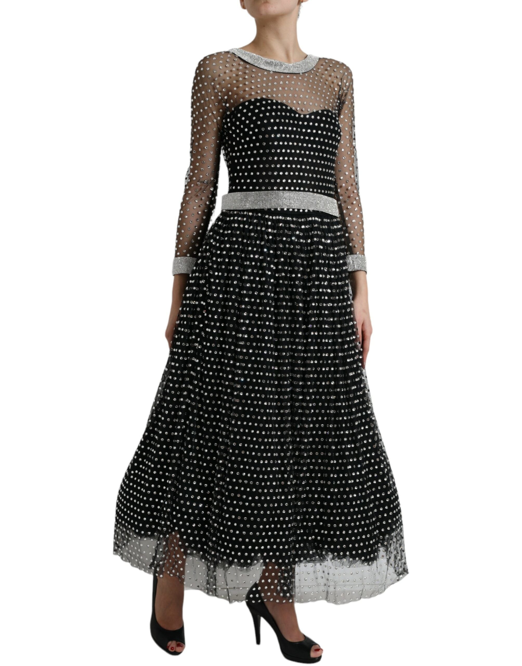 Black crystal-embellished A-line gown dress by Dolce & Gabbana with intricate detailing and flowing fabric.