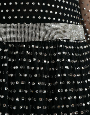 Black crystal-embellished A-line gown dress by Dolce & Gabbana with intricate detailing and flowing fabric.