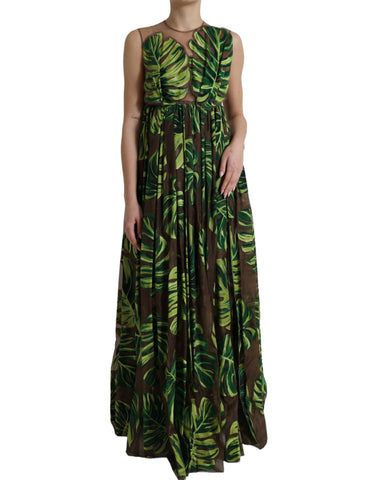 Green banana leaf sleeveless maxi dress by Dolce & Gabbana, flowing fabric with a vibrant botanical print.