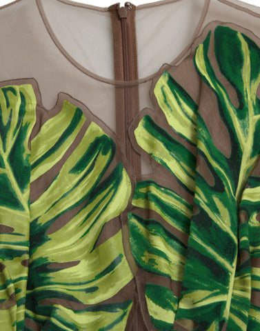 Green Banana Leaf sleeveless maxi dress by Dolce & Gabbana, flowing fabric with tropical leaf pattern and elegant long silhouette.