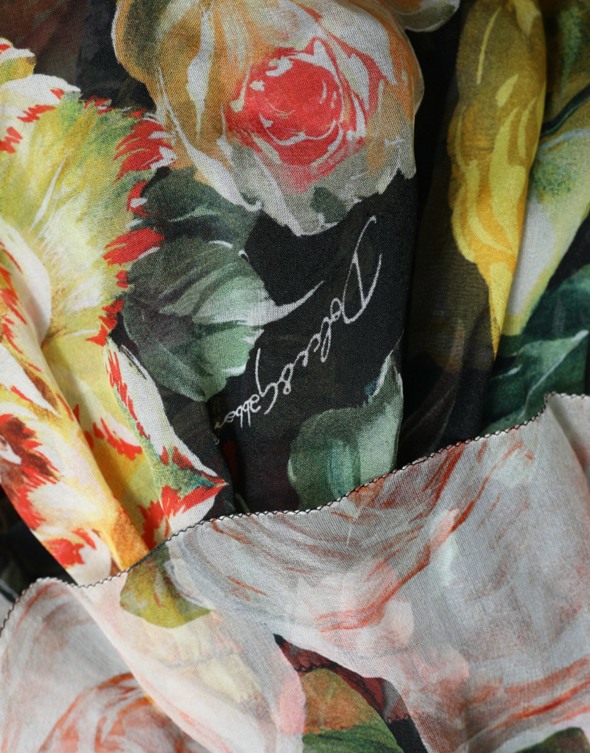 Multicolor floral chiffon tiered maxi dress by Dolce & Gabbana with flowing fabric and vibrant flower patterns.