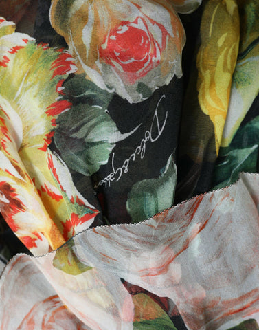 Multicolor floral chiffon tiered maxi dress by Dolce & Gabbana with flowing fabric and vibrant flower patterns.