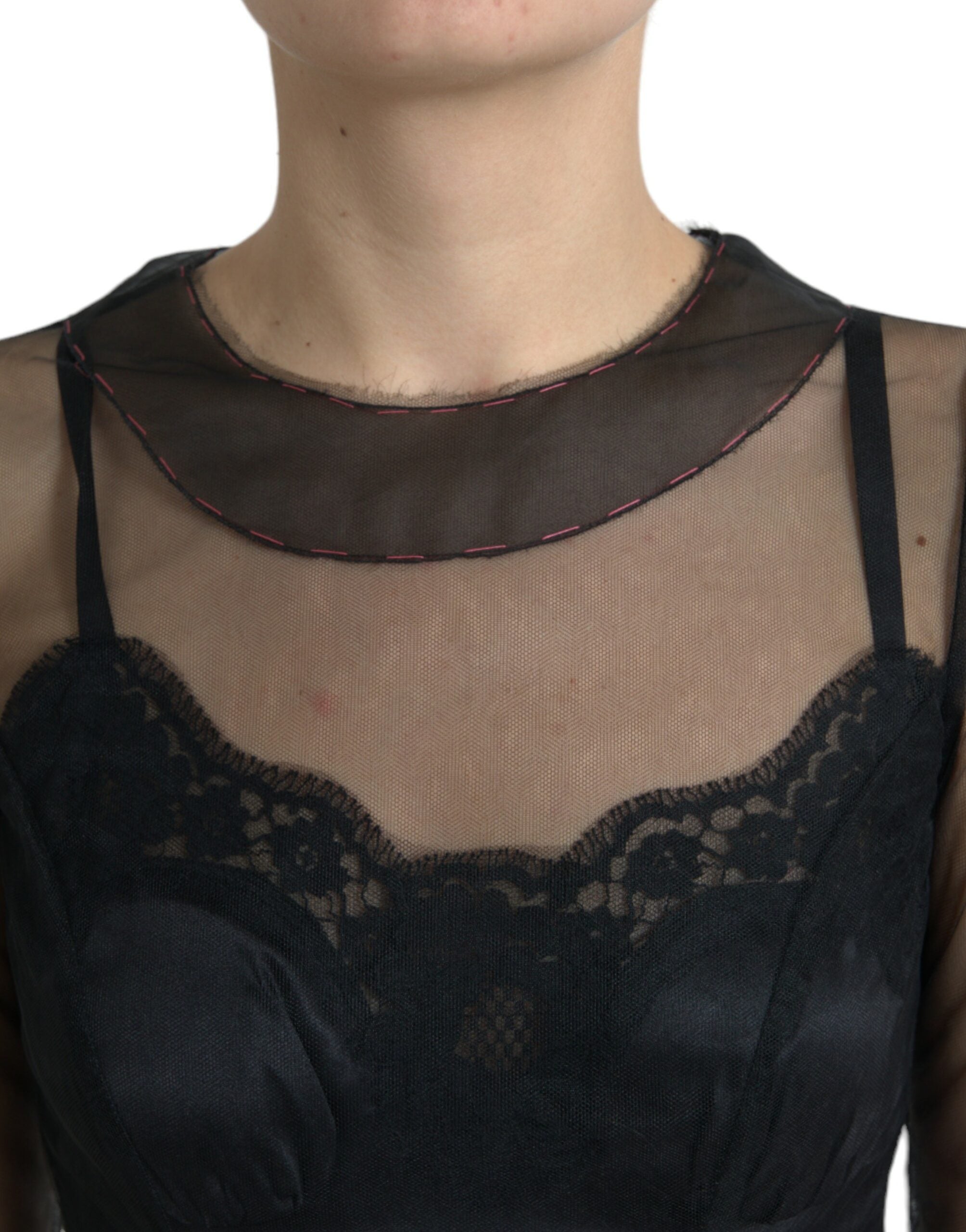 Black floral embroidery mesh tulle gown by Dolce & Gabbana with intricate floral embroidery and sheer mesh fabric.