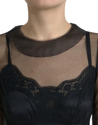 Black floral embroidery mesh tulle gown by Dolce & Gabbana with intricate floral embroidery and sheer mesh fabric.