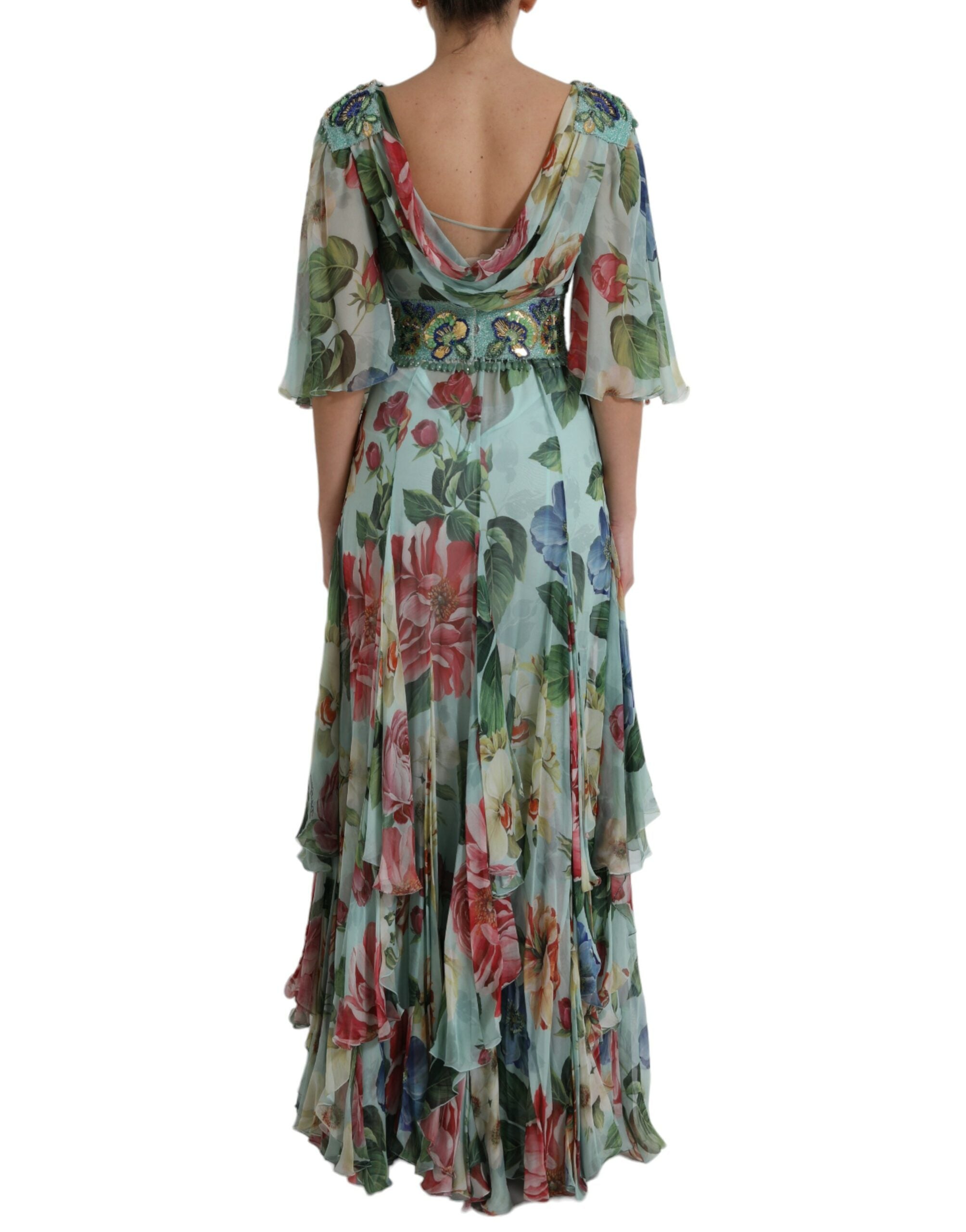 Blue floral print tiered long maxi dress by Dolce & Gabbana, featuring flowing fabric and intricate floral patterns.