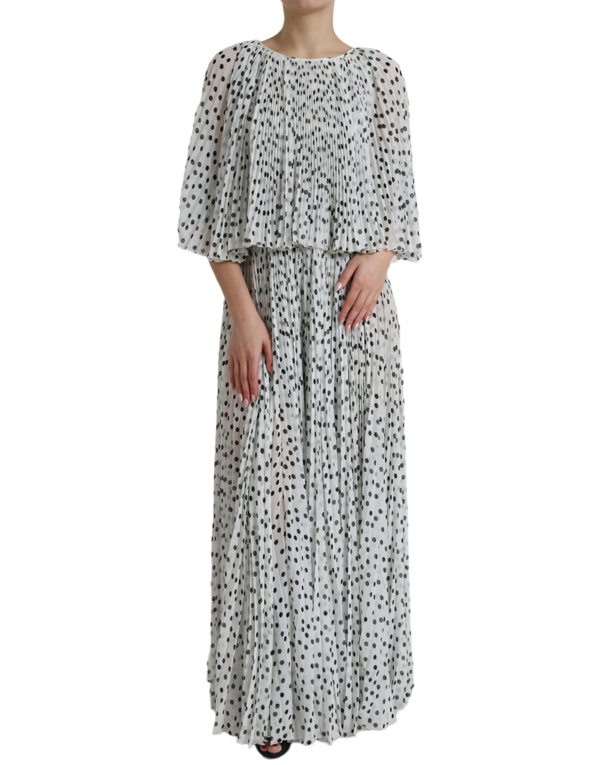 White polka dot A-line pleated maxi dress by Dolce & Gabbana, featuring a flowy silhouette and classic polka dot pattern.