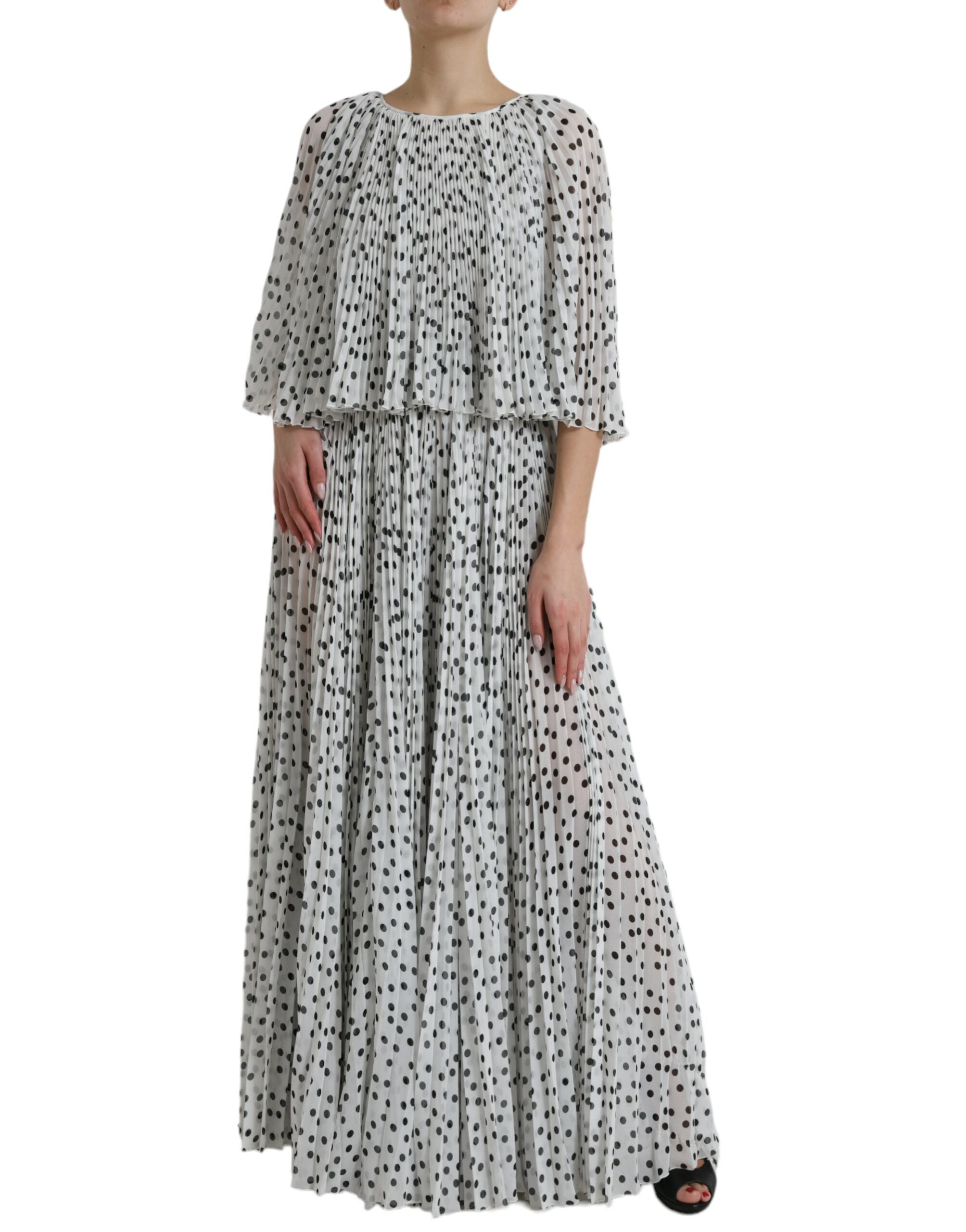 White polka dot A-line pleated maxi dress by Dolce & Gabbana, featuring a flowing silhouette and stylish design.