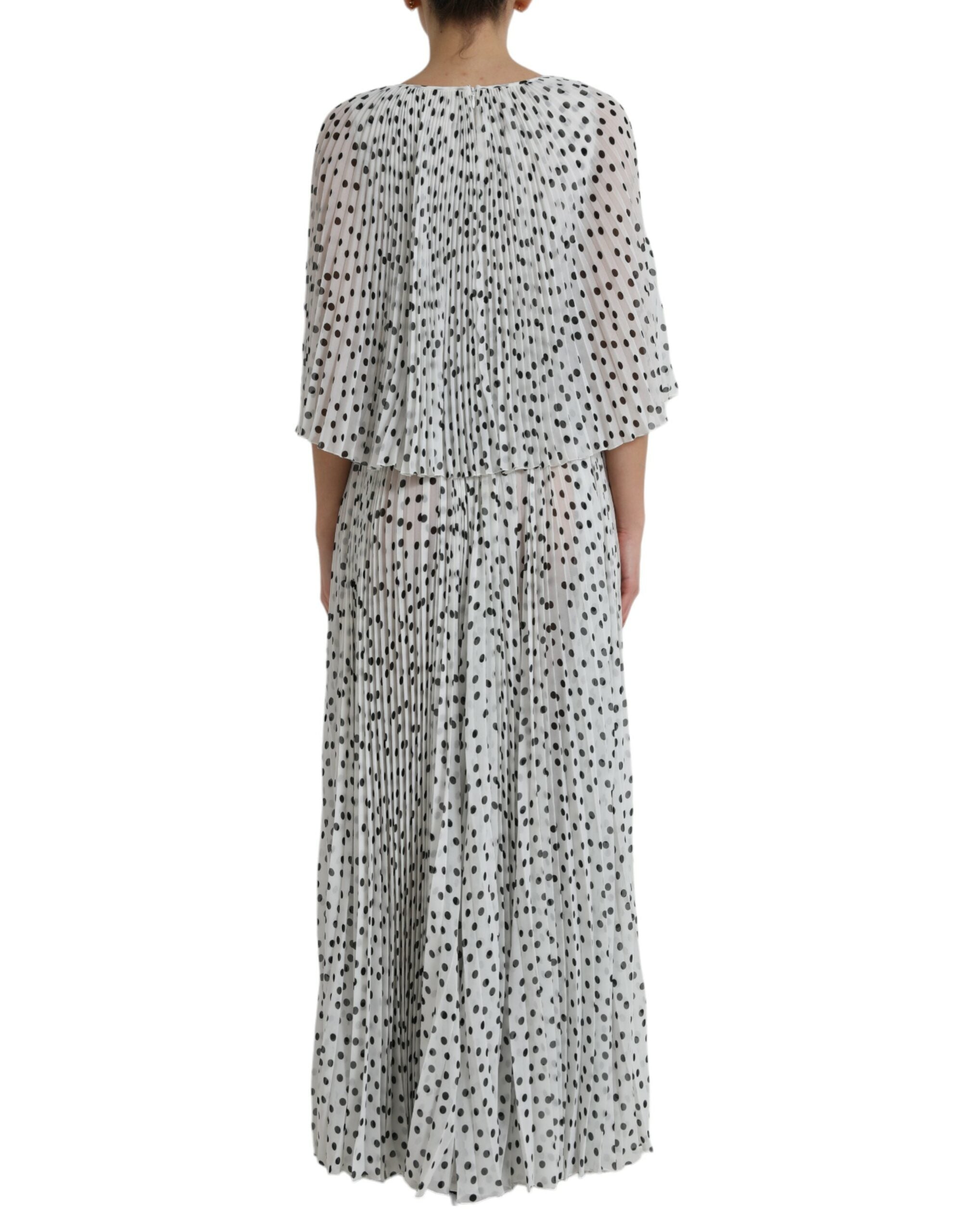 White polka dot A-line pleated maxi dress by Dolce & Gabbana, flowing fabric with a fitted waist and elegant design.