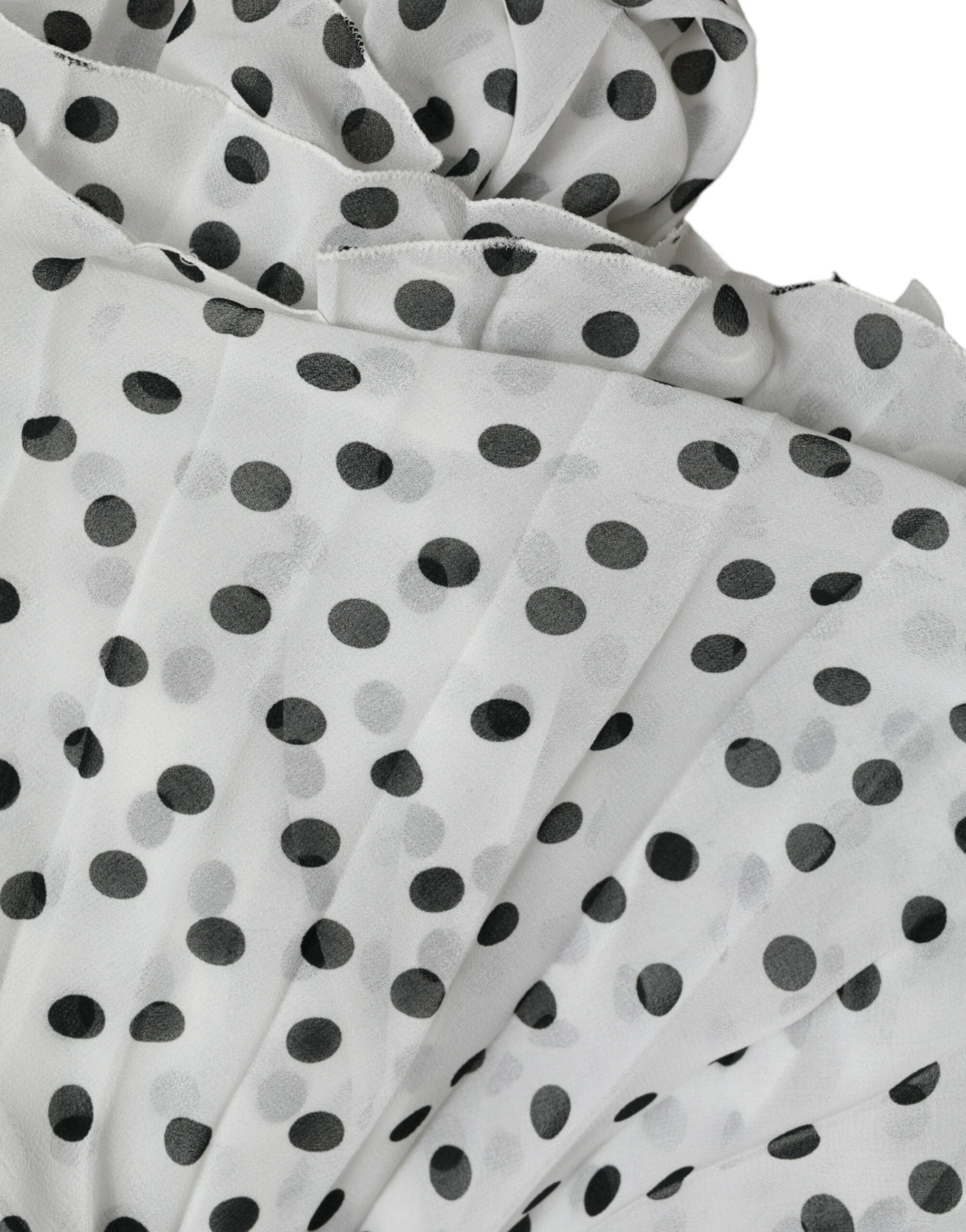 White polka dot A-line pleated maxi dress by Dolce & Gabbana, featuring a flowing silhouette and classic pattern.