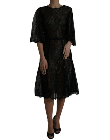Black floral lace sheer A-line midi dress by Dolce & Gabbana, featuring intricate lace details and a flowing silhouette.