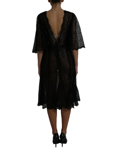 Black floral lace sheer A-line midi dress by Dolce & Gabbana, featuring intricate lace details and a flowing silhouette.