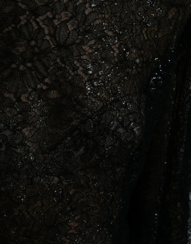 Black floral lace sheer A-line midi dress by Dolce & Gabbana, featuring intricate lace details and a flowing silhouette.