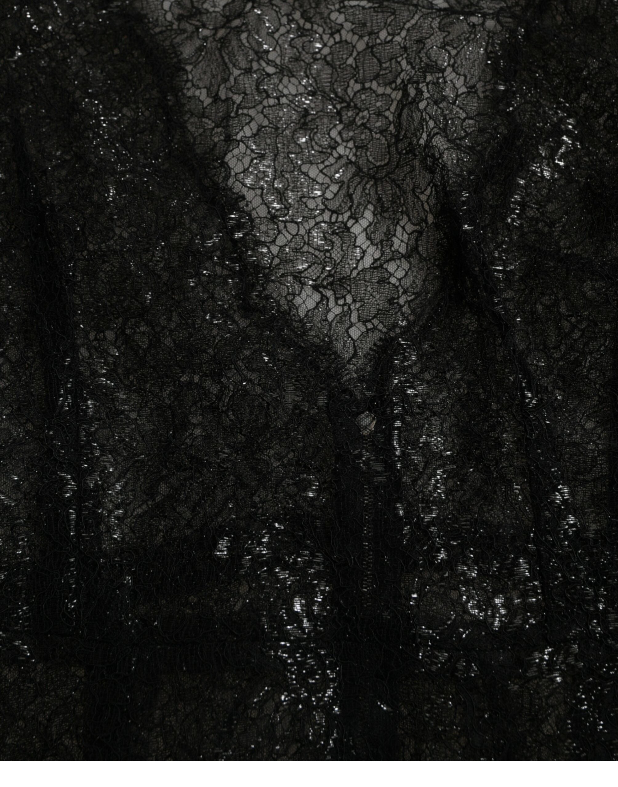 Black floral lace sheer A-line midi dress by Dolce & Gabbana, featuring intricate lace detailing and a flowing silhouette.