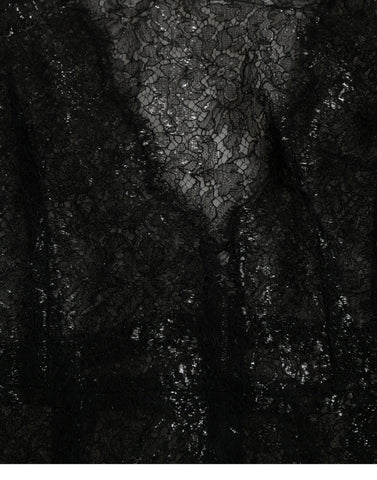 Black floral lace sheer A-line midi dress by Dolce & Gabbana, featuring intricate lace detailing and a flowing silhouette.