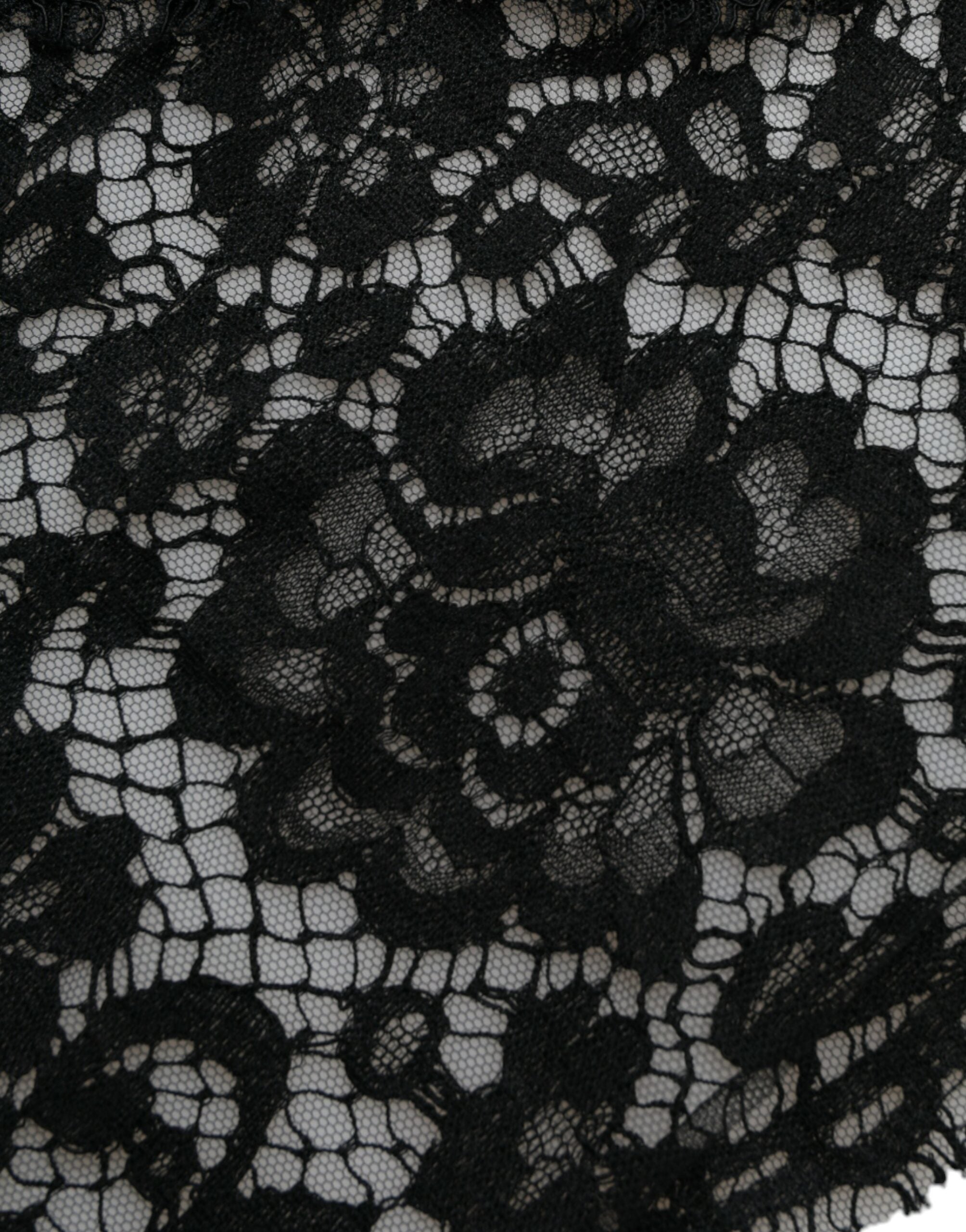 Black lace sheath dress with crystal embellishments from Dolce & Gabbana, featuring intricate lace details and a fitted silhouette.