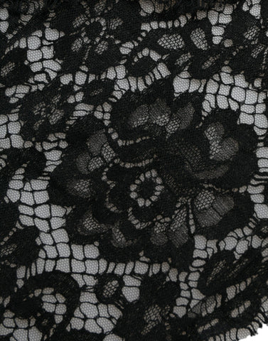 Black lace sheath dress with crystal embellishments from Dolce & Gabbana, featuring intricate lace details and a fitted silhouette.