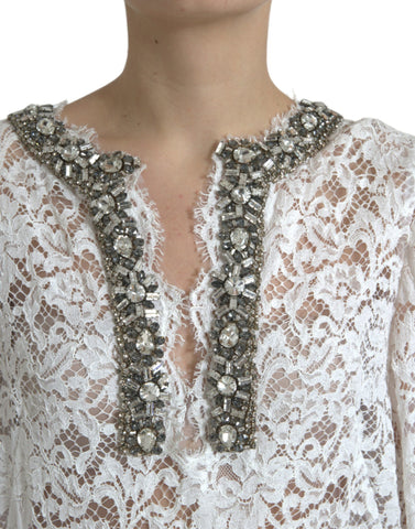 White lace shift dress with crystal embellishments by Dolce & Gabbana, featuring a elegant, sleeveless design and intricate lace details.