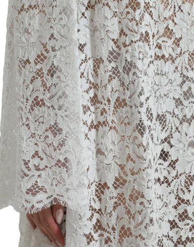 White lace shift dress with crystal embellishments by Dolce & Gabbana, featuring intricate lace details and elegant design.