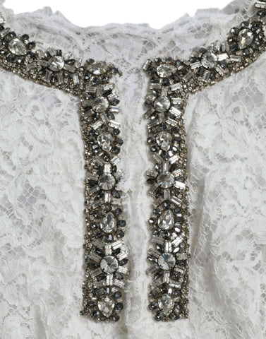 White lace shift dress with crystal embellishments by Dolce & Gabbana, featuring intricate lace details and elegant design.