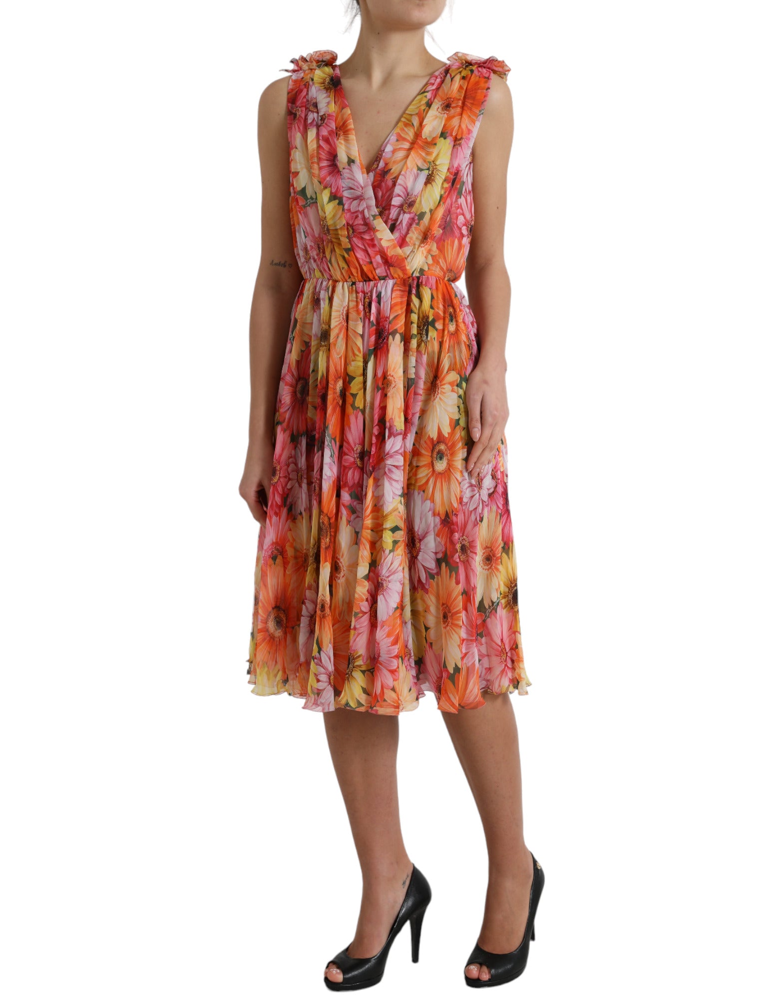 Multicolor sunflower print silk midi dress by Dolce & Gabbana displayed on a hanger with vibrant floral pattern.