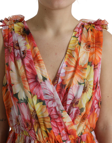 Dolce & Gabbana multicolor sunflower print silk midi dress displayed on a mannequin, showcasing vibrant floral pattern and elegant design.