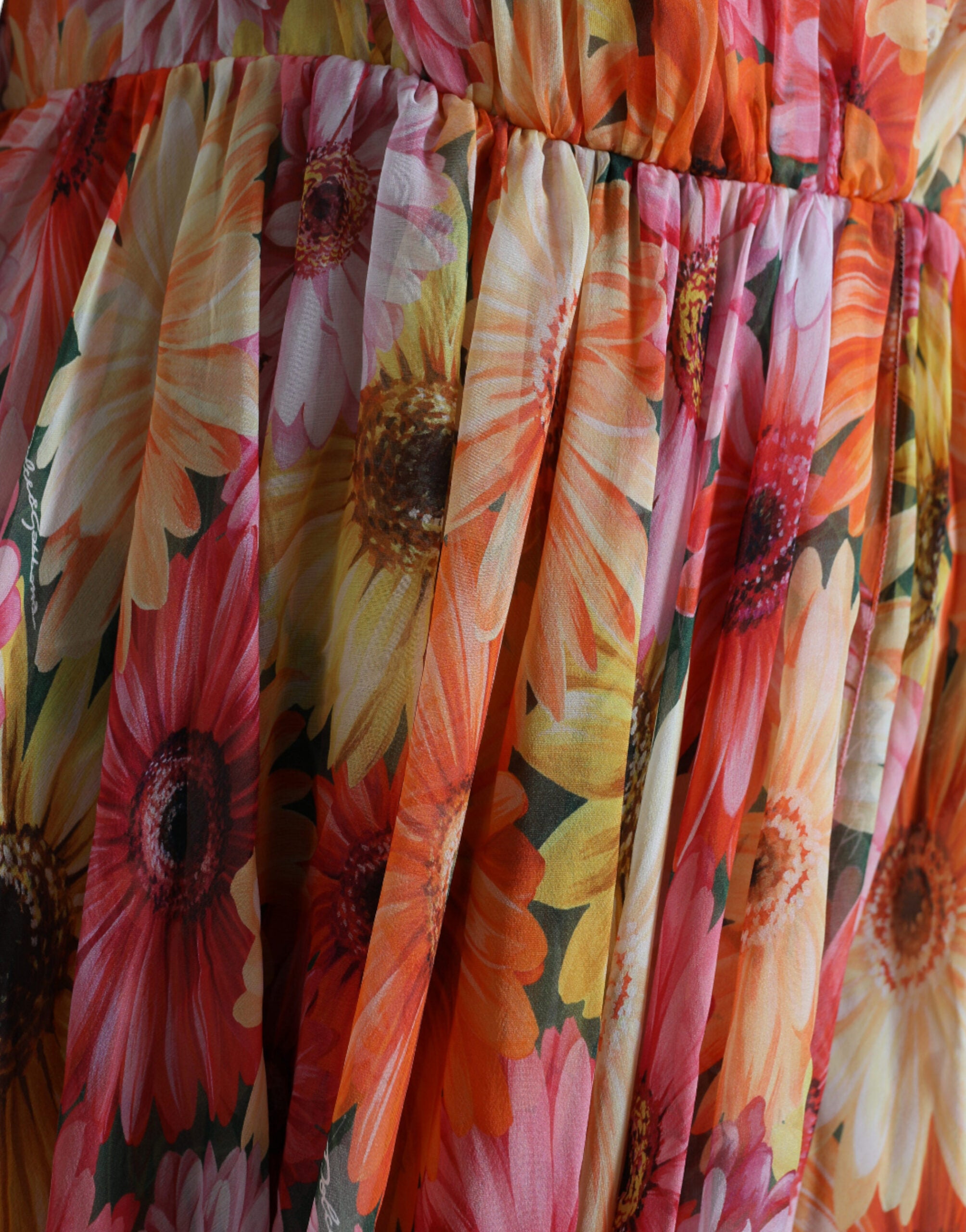 Multicolor sunflower print silk midi dress by Dolce & Gabbana, featuring vibrant floral pattern and elegant flowy design.