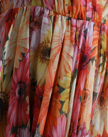 Multicolor sunflower print silk midi dress by Dolce & Gabbana, featuring vibrant floral pattern and elegant flowy design.