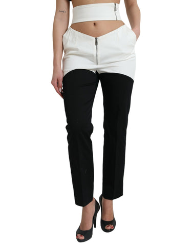 Black and white cotton tapered pants with cut-out waist from Dolce & Gabbana, featuring a sleek, modern design.