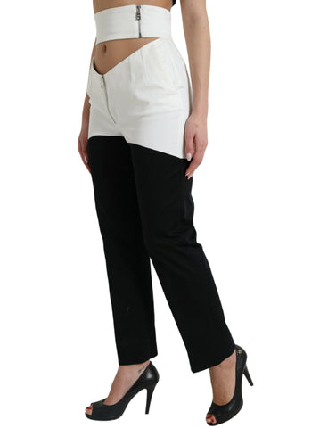 Black and white cotton tapered pants with cut-out waist from Dolce & Gabbana, featuring a sleek, modern design.