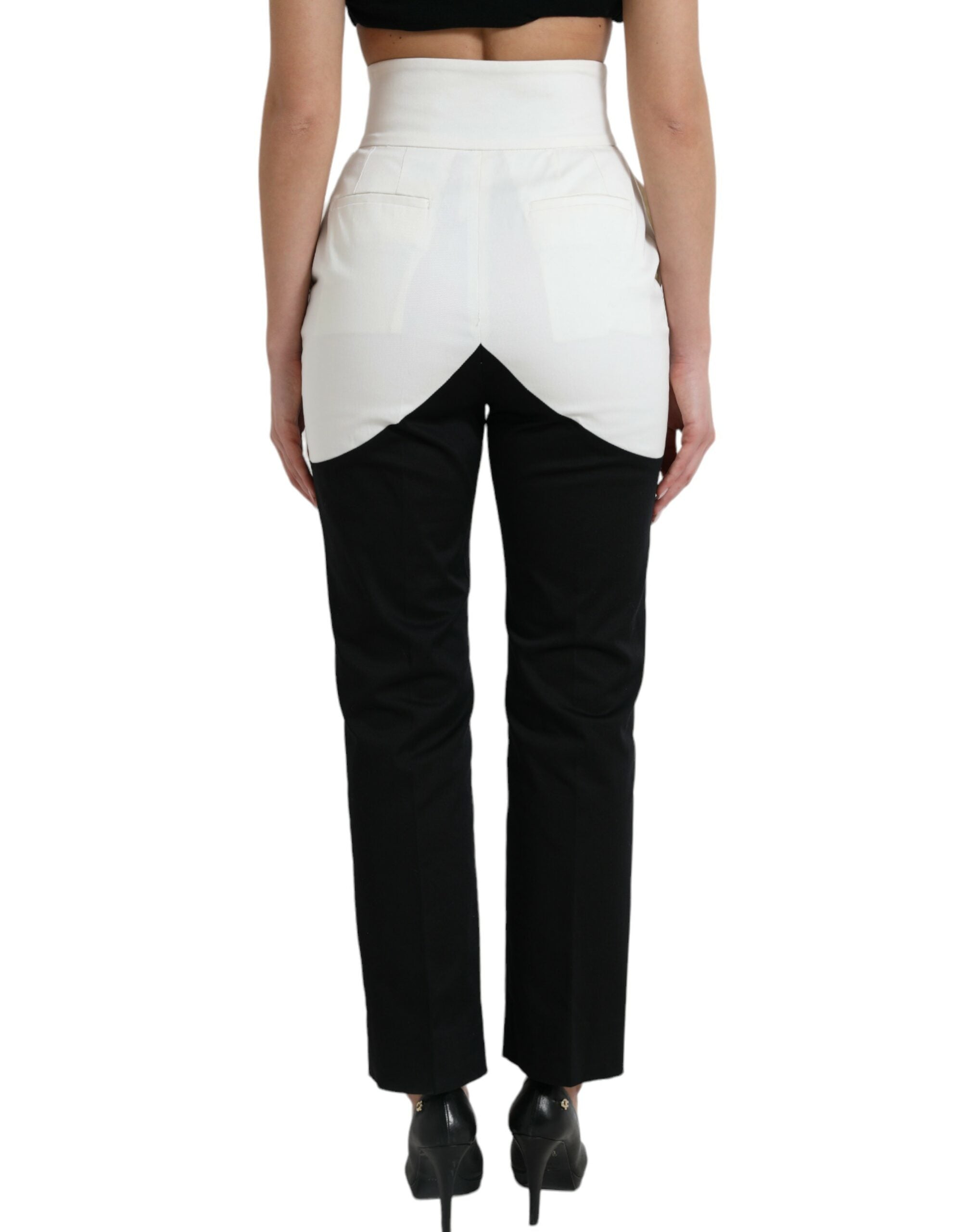 Black and white cotton tapered pants with cut-out waist from Dolce & Gabbana, featuring a sleek, modern design.