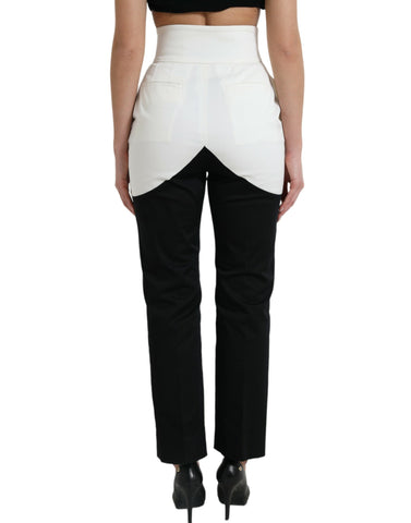 Black and white cotton tapered pants with cut-out waist from Dolce & Gabbana, featuring a sleek, modern design.