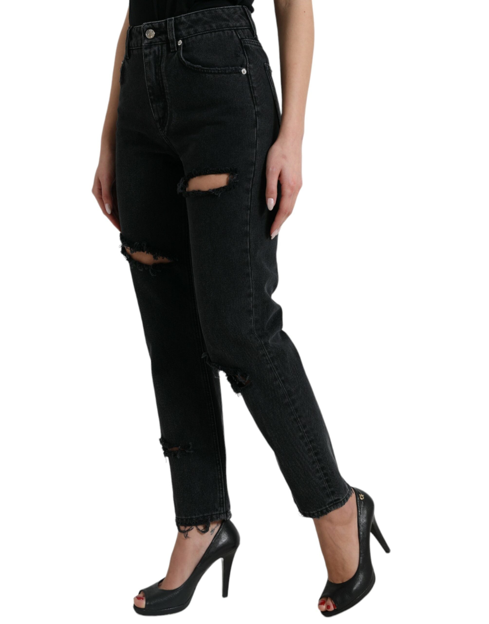 Black high waist cotton tattered denim jeans by Dolce & Gabbana, shown on model with distressed details and classic fit.