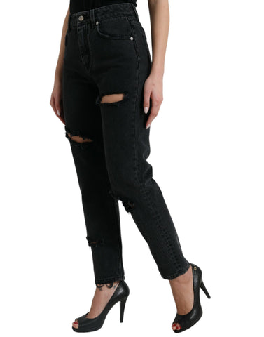Black high waist cotton tattered denim jeans by Dolce & Gabbana, shown on model with distressed details and classic fit.