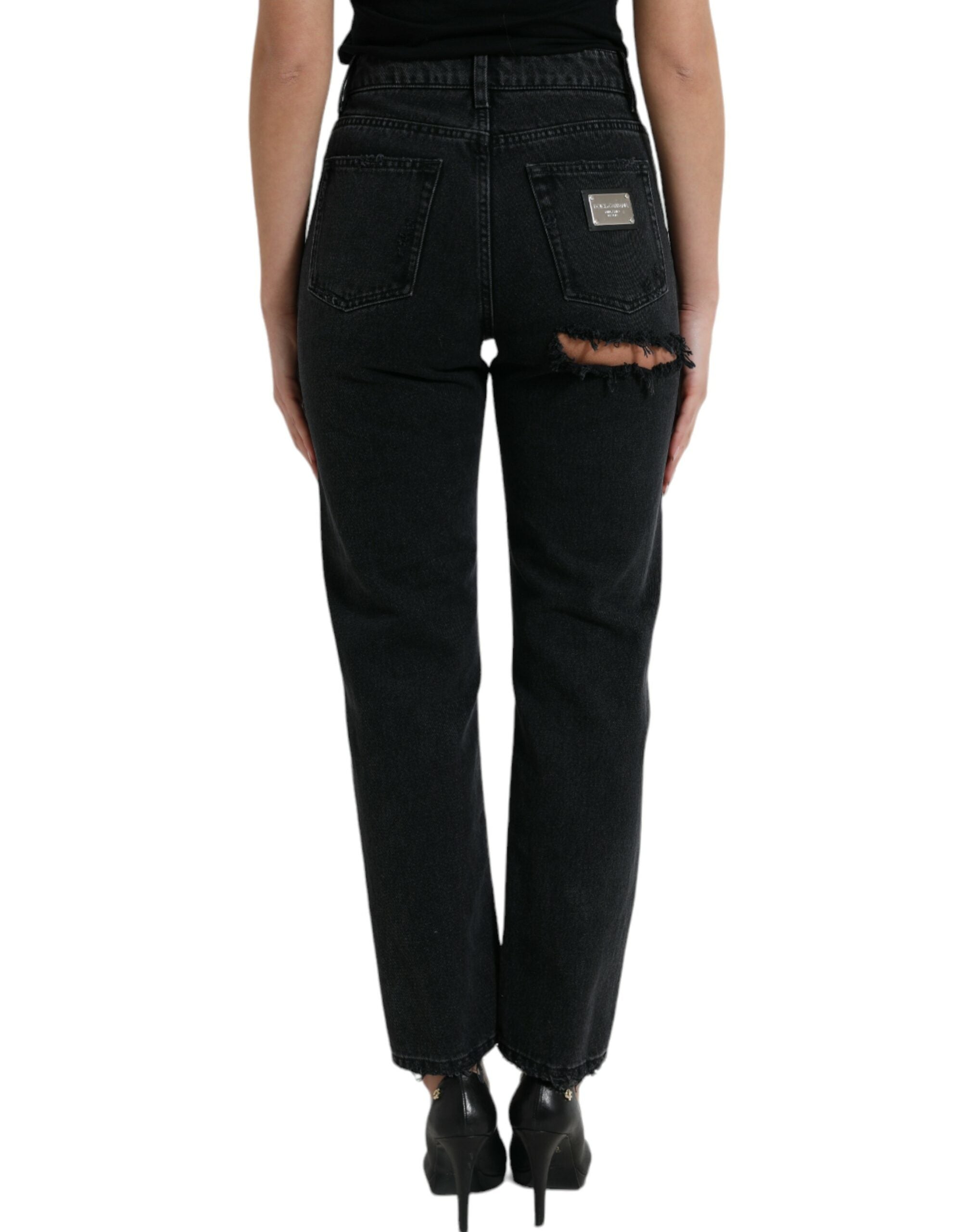 Black cotton high waist tattered denim jeans by Dolce & Gabbana, showing distressed details and classic five-pocket style.