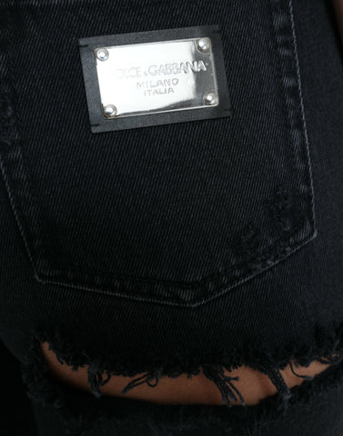 Black cotton high waist tattered denim jeans by Dolce & Gabbana, shown with distressed details and classic fit.