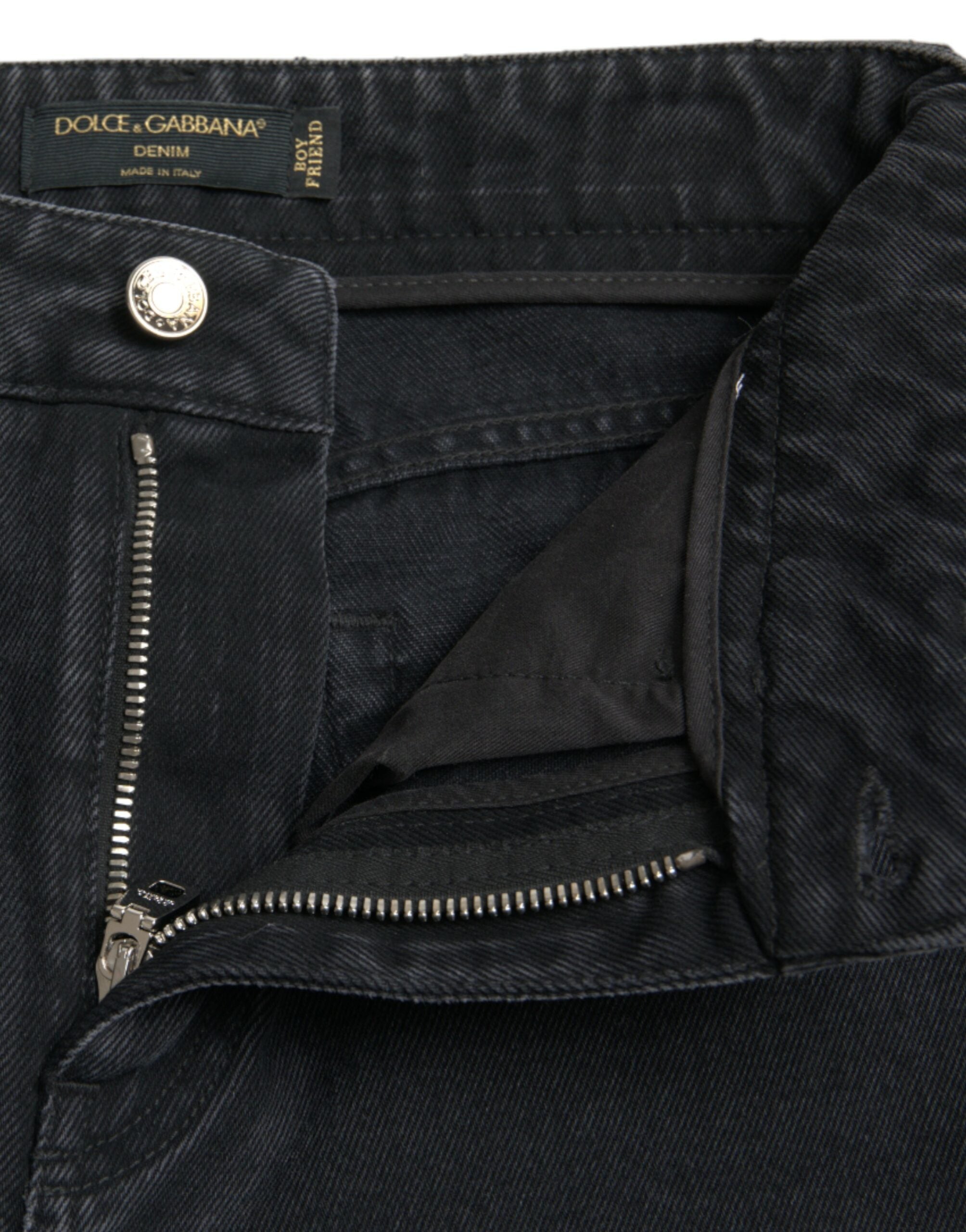 Black cotton high-waist tattered denim jeans by Dolce & Gabbana, showing distressed details and classic fit.