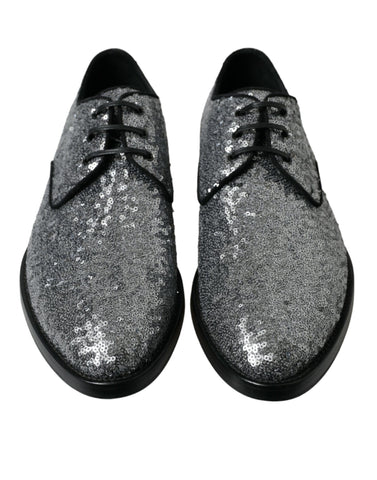 Silver sequined lace-up men's derby dress shoes by Dolce & Gabbana, featuring a shiny, stylish design with intricate detailing.