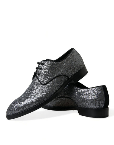 Silver sequined lace-up men's derby dress shoes by Dolce & Gabbana with a sleek, shiny finish and elegant design.