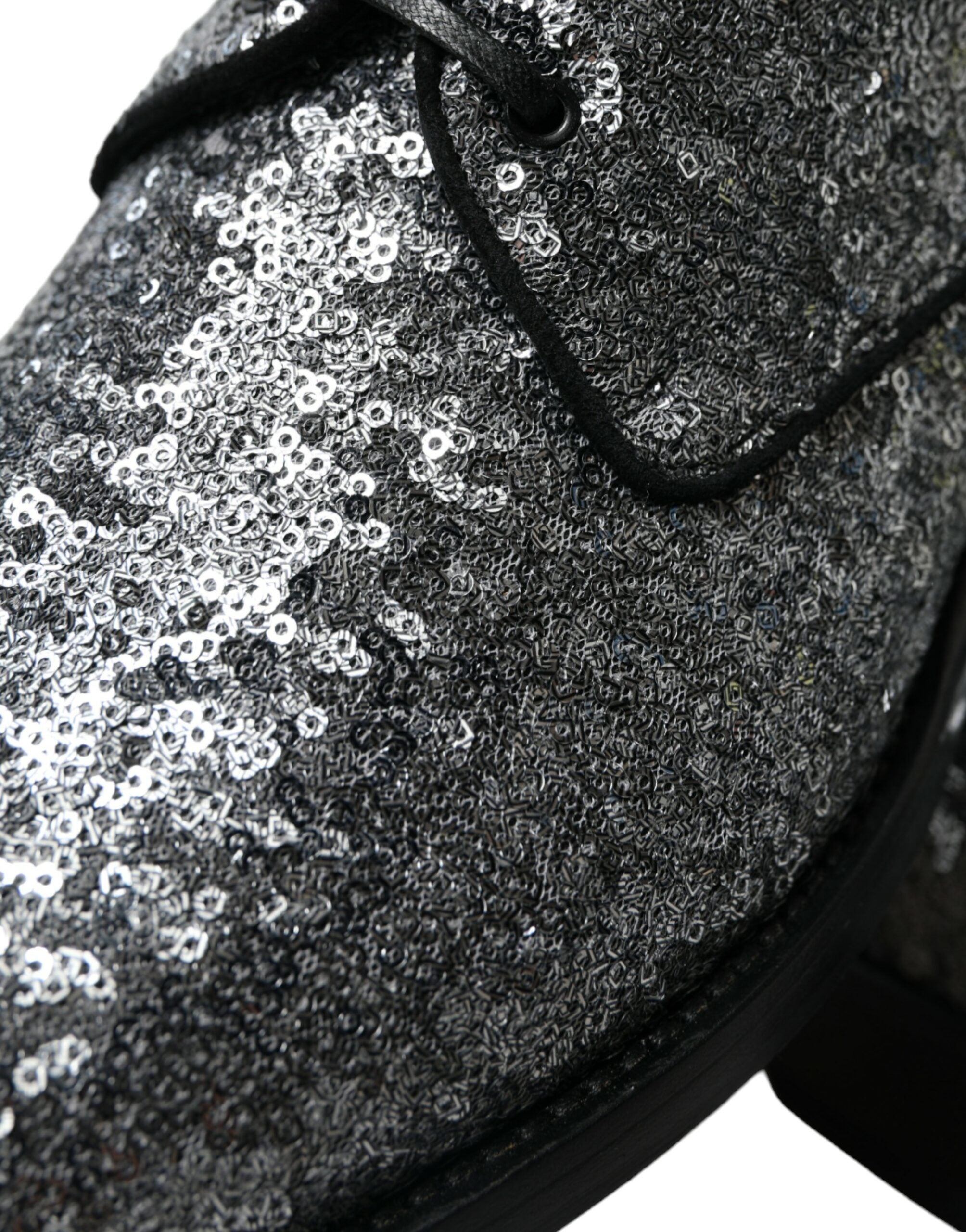 Silver sequined lace-up men's derby dress shoes by Dolce & Gabbana with a polished finish and stylish design.