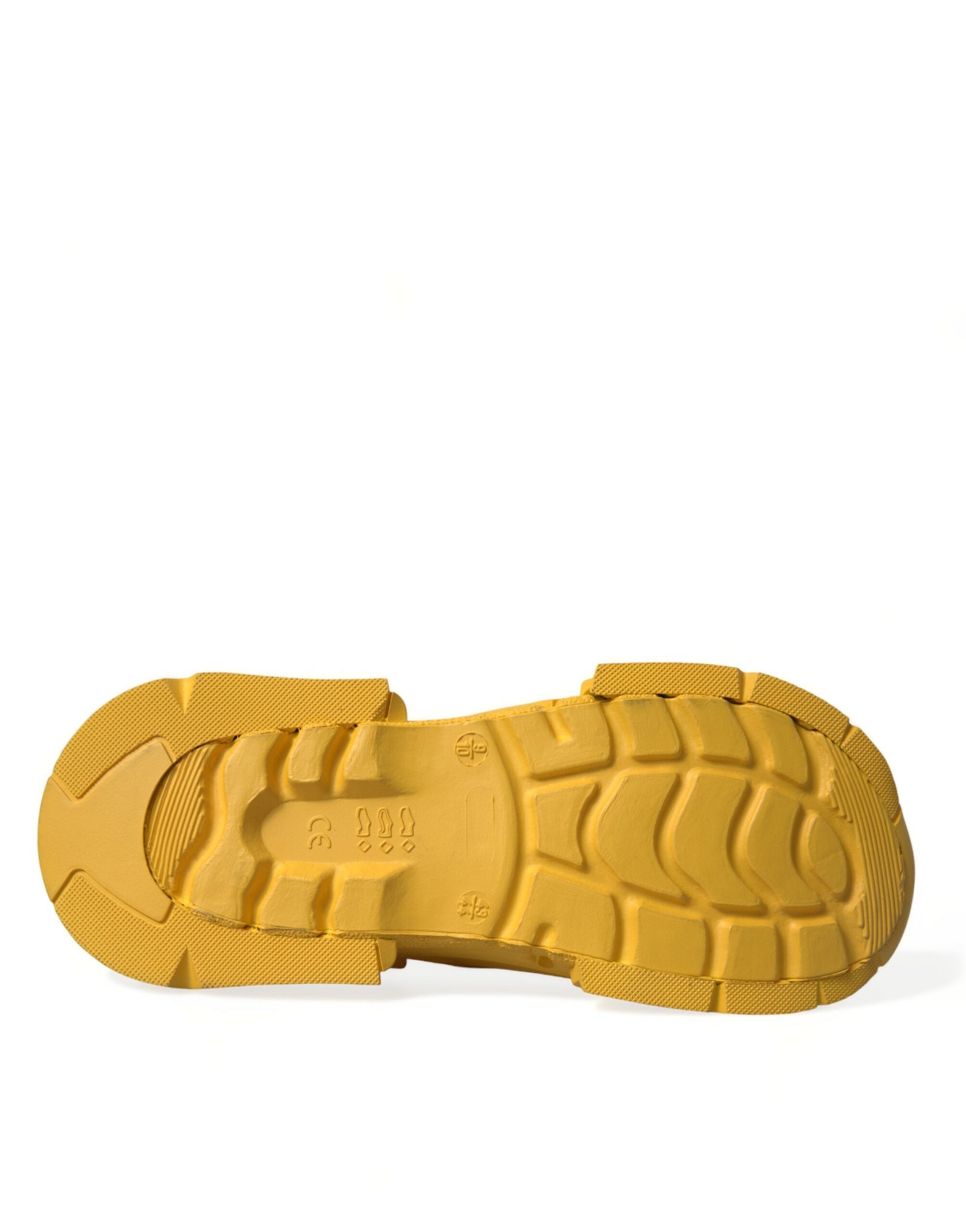Yellow and green rubber clogs for men by Dolce & Gabbana, featuring slip-on design and casual footwear style.