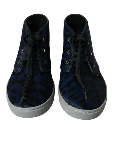 Blue calfskin leopard print mid-top sneakers from Dolce & Gabbana with white laces and rubber sole.